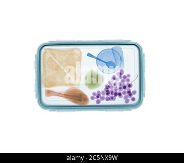 Packed lunchbox, coloured X-ray. Stock Photo