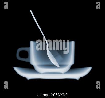 Coffee cup, spoon and two sugars, X-ray Stock Photo