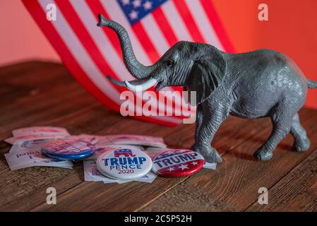 Washington DC--July 4, 2020; Donald Trump and Mike Pence campaign buttons on I voted stickers with toy GOP republican elephant and American flag in ba Stock Photo