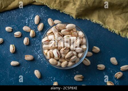 Roasted And Salted Pistachios In Glass Bowl Stock Photo