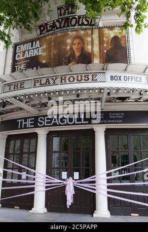 London, UK, 4 July 2020: The Playhouse Theatre is decorated with tape saying 'Missing Live Theatre #sceneschange', part of a campaign todraw attention to the funding crisis in British theatre. The Playhouse should have been enjoying a run of The Seagull, starring Game of Thrones actor Emilia Clarke, but like all others in the UK has had to close it's doors due to coronavirus. Anna Watson/Alamy Stock Photo