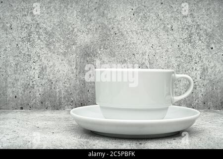 White cup with saucer on a light background. Dishes for coffee. Coffee cup Stock Photo