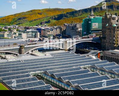 View from above of glass roof of Waverley mainline railway station and North Bridge, Edinburgh city centre, Scotland, UK
