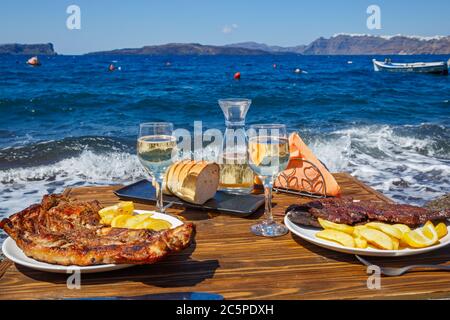 Lunch on the seashore on a wooden table Stock Photo