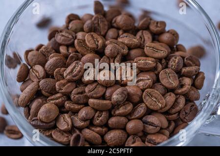 hole coffee beans in a cup Stock Photo