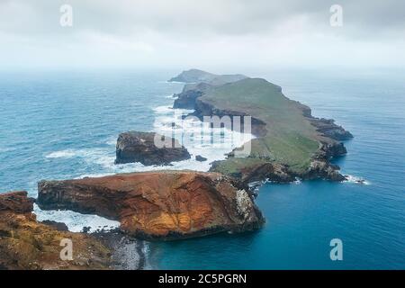 Sao Lourenco view with Atlantic ocean bay from Pico do Furado - the headland's highest point in the end of February, Madeira island, Portugal. Stock Photo