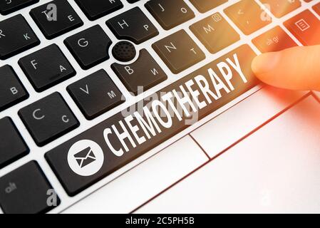 Conceptual hand writing showing Chemotherapy. Concept meaning the treatment of disease by the use of chemical substances Pc keyboard key with pointing Stock Photo