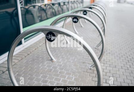 Empty bike share station on the deserted Zilina city streets in Slovakia as a coronavirus spreading result. Global COVID-19 pandemic concept image. Stock Photo