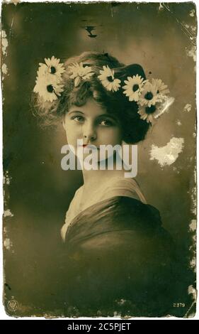 RUSSIA - CIRCA 1915: Retro postcard depicts young woman portrait, circa 1915, Russia. Vintage hand-tinted photograph Stock Photo