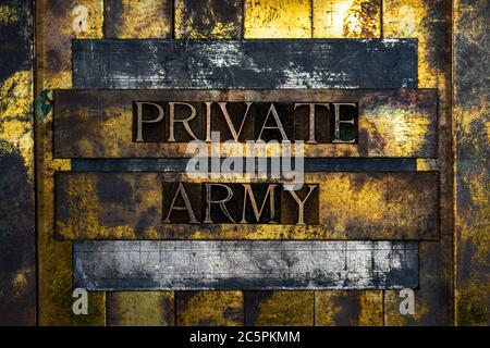 Private Army text formed with real authentic typeset letters on vintage textured silver grunge copper and gold background Stock Photo