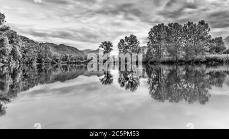 Reflections in the river, Italy landscape Stock Photo