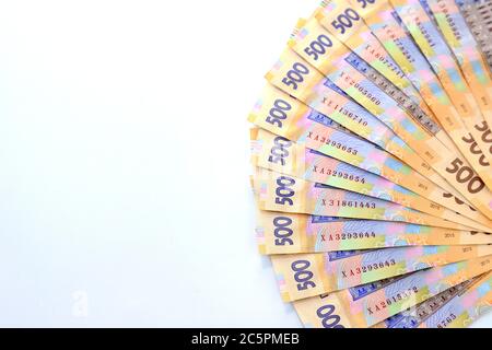 Ukrainian hryvnia, new banknotes of 500 hryvnias on a white background, diagonal position, close-up, isolated. Money background, concept of gifts Stock Photo