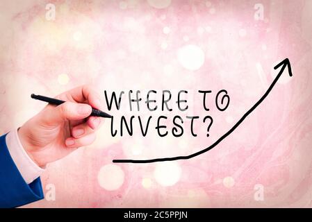 Handwriting text writing Where To Invest Question. Conceptual photo fundraising money to start business project startup digital arrowhead curve rising Stock Photo