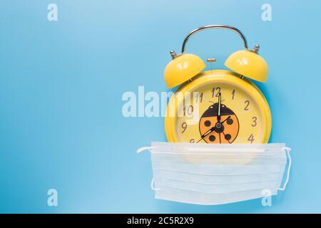 Ringing twin bell vintage classic alarm clock on blue pastel colorful trendy  Stock Photo