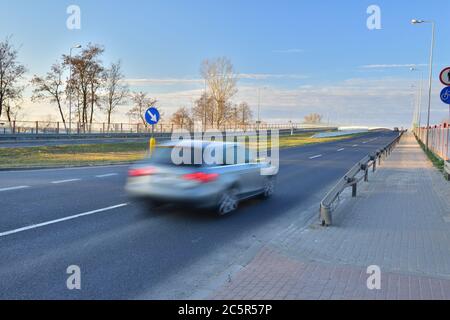 Auto when driving at long shutter speeds. Motion blur. Spring. Stock Photo