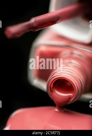 Red nail polish spilling out Stock Photo