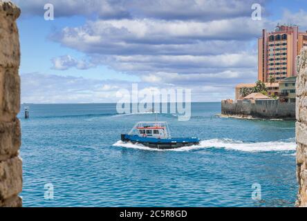 Pilot Boat Through Stone Wall in Curacao Stock Photo