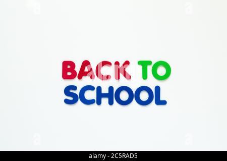 red, green and blue foam  letters spelling 'Back to School' in two rows  isolated on white Stock Photo