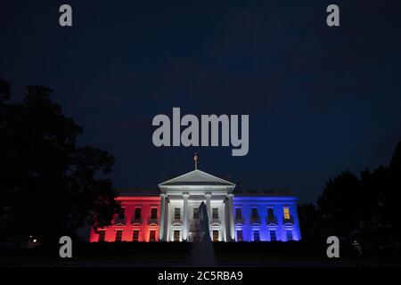 Washington, United States. 04th July, 2020. The White House is lit up in red, white, and blue following United States President Donald J. Trump's Fourth of July 'Salute to America' event in Washington, DC on Saturday, July 4, 2020. Trump pushed forward with his planned Fourth of July celebration, even as many officials urged the public to stay home and avoid gathering in large crowds due to the ongoing Coronavirus pandemic. Photo by Stefani Reynolds/UPI Credit: UPI/Alamy Live News