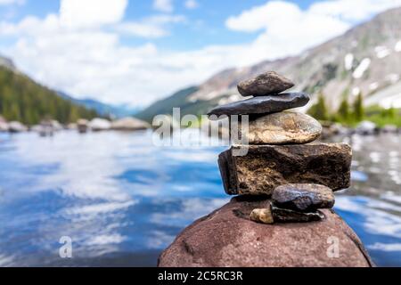 Hot springs pool peak and rock stack cairn on Conundrum Creek Trail in Aspen, Colorado in 2019 summer with view and nobody in USA Stock Photo