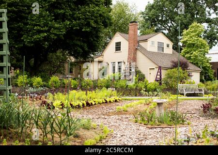 The 1700s farmhouse, cottage garden, and vegetable garden at Tower Hill Botanic Garden in Boylston, Massachusetts, USA. Stock Photo