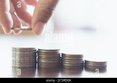 Business financial success concept. Gold coins on table and green nature bokeh background.Bullish market situation. Stock Photo