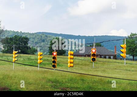 Afton, Nelson County, Virginia countryside rural point of view driving with road sign traffic red light signal and house in background in summer Stock Photo