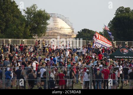 Washington, United States. 04th July, 2020. A crowd gathers to watch United States President Donald J. Trump's Fourth of July 'Salute to America' event across from the White House in Washington, DC on Saturday, July 4, 2020. Trump pushed forward with his planned Fourth of July celebration, even as many officials urged the public to stay home and avoid gathering in large crowds due to the ongoing Coronavirus pandemic. Photo by Stefani Reynolds/UPI Credit: UPI/Alamy Live News