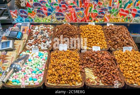 BARCELONA, SPAIN - JULY 6, 2015: Nuts and almonds for sale at the Mercat de Sant Josep de la Boqueria in Barcelona. It is a large public market in the Stock Photo