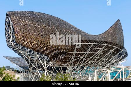 BARCELONA, SPAIN - JULY 12, 2015: Frank Gehry's modern El Peix d'Or sculpture is located in Barcelona's Vila Olimpica, Olympic Village for the 1992 Ol Stock Photo