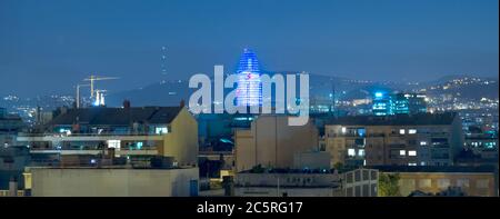 BARCELONA, SPAIN - JULY 14, 2015: Torre Agbar at night from residential district of barcelona. The tower has a total of 50693 square metres, of which Stock Photo