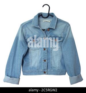 Denim jacket on a hanger. Isolated on white. Clipping path included. Stock Photo