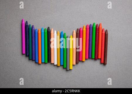 Wax crayons in row, top view. Minimal image and place for text Stock Photo