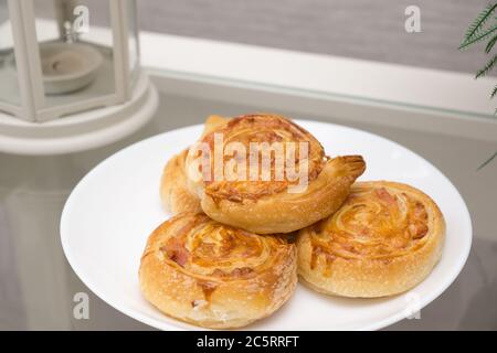 fresh fragrant pie in the shape of rolls Stock Photo
