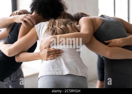 Group of multiethnic sporty people telling motivational pep talk. Stock Photo