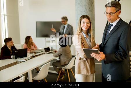 Creative executives using digital tablet in the office Stock Photo