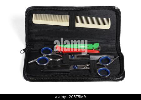 Hairdresser Tool Set in Open Bag on White Background Stock Photo