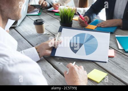 Business people analyzing data diagrams financial reports development strategy Stock Photo