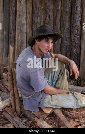 Tobacco farmer smoking a cigar during a break in Vinales Valley, Pinar del Rio, Cuba. Stock Photo