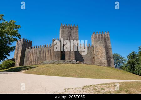 Guimarães, Portugal - Emblematic Medieval Castle in Holy Hill - built under the orders of Mumadona Dias in the 10th century to defend from attacks by Stock Photo