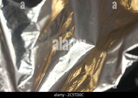 Gold foil leaf shiny metallic wrapping paper texture background for wall paper decoration element Stock Photo
