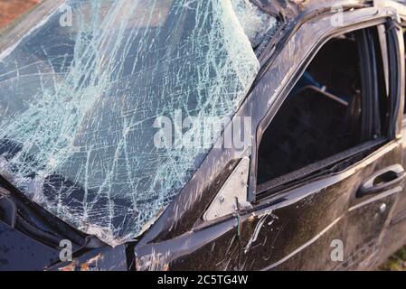 Broken after the accident windshield. Broken windshield Broken glass Glass in cracks. Stock Photo