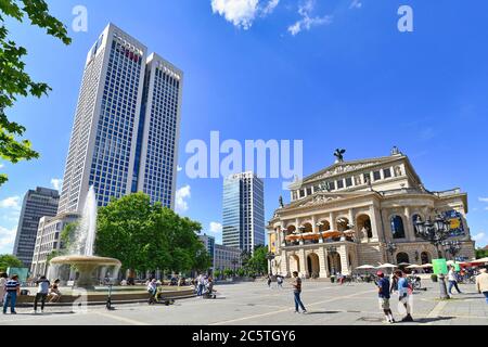 Frankfurt am Main, Germany - June 2020: Old historical opera house concert hall called 'Alte Oper' and tower building of investment bank called 'UBS' Stock Photo