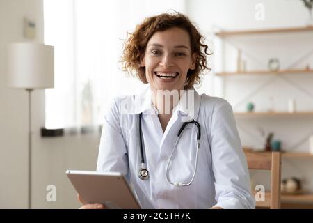 Portrait of smiling female doctor using tablet Stock Photo