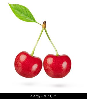Two cherries with leaf isolated on white background. Clipping path. Stock Photo