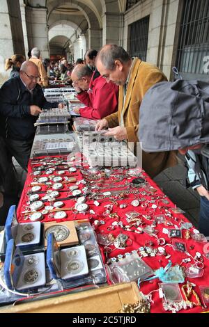 MADRID, SPAIN - OCTOBER 21, 2012: Shoppers visit Sunday Collectible Market in Plaza Mayor, Madrid. The weekly market is one of most popular of its kin Stock Photo