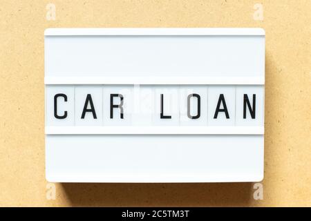 Lightbox with word car loan on wood background Stock Photo