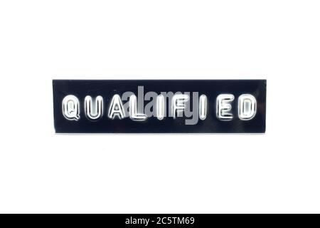 Embossed letter in word qualifiedon black banner with white background Stock Photo