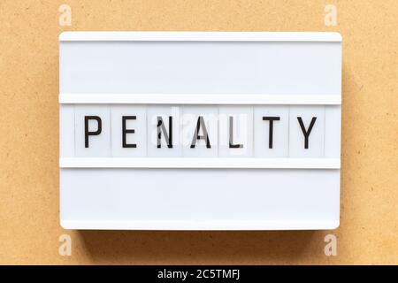 Lightbox with word penalty on wood background Stock Photo