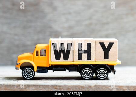 Truck hold letter block in word  on wood background Stock Photo